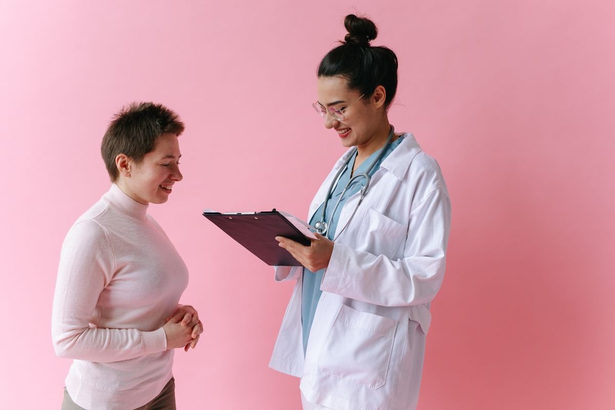 Doctor smiling while consulting a patient